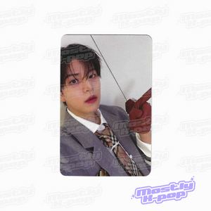 Photo card with a member portrait in a gray suit jacket and red finger pose