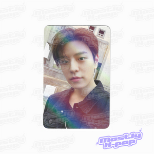 Rounded photo card of an idol portrait looking forward, dark patterned shirt