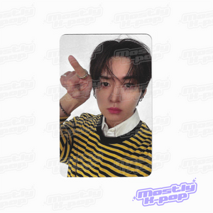 Photo card with a member portrait wearing a black-and-yellow striped shirt