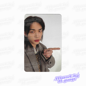 Photo card with a member portrait in a gray blazer and pointing gesture