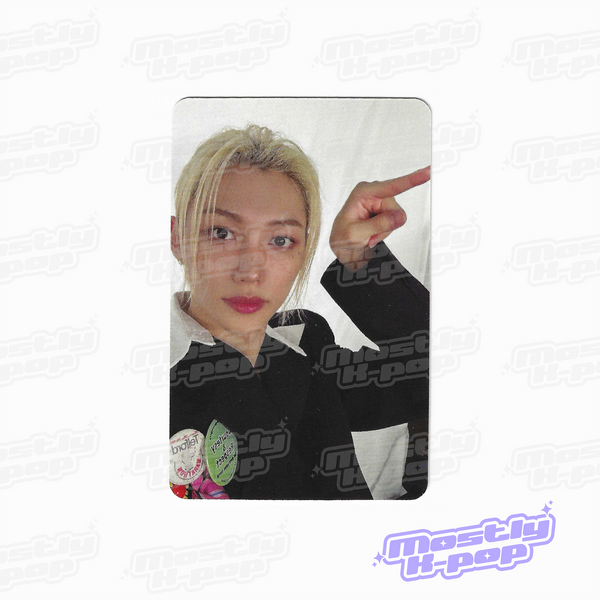 Photo card featuring a member portrait with blond hair in a black jacket