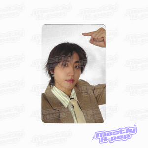 Photo card with a member portrait in a brown jacket and pointing gesture