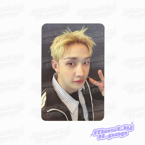 Single portrait photo card of blonde member making a peace sign