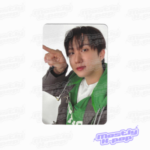 Photo card with a member portrait in a green shirt and dark blazer