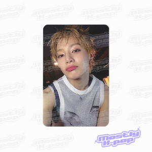 Portrait photo card of a man with light brown hair, wearing a white mesh sleeveless top.