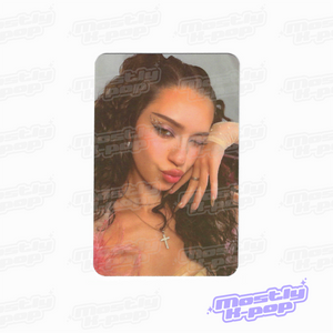 Collectible photocard with a close-up portrait of a woman with long dark hair and jewelry