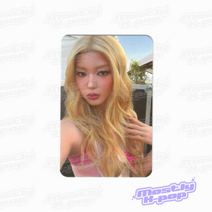 Collectible photocard featuring a close-up portrait of a blonde woman outdoors
