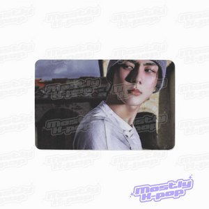 Rectangular photo card featuring a side-profile portrait of a person in a white shirt.