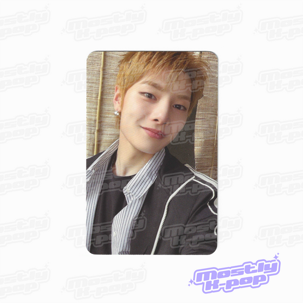 Single portrait photo card of light brown haired member smiling in black jacket