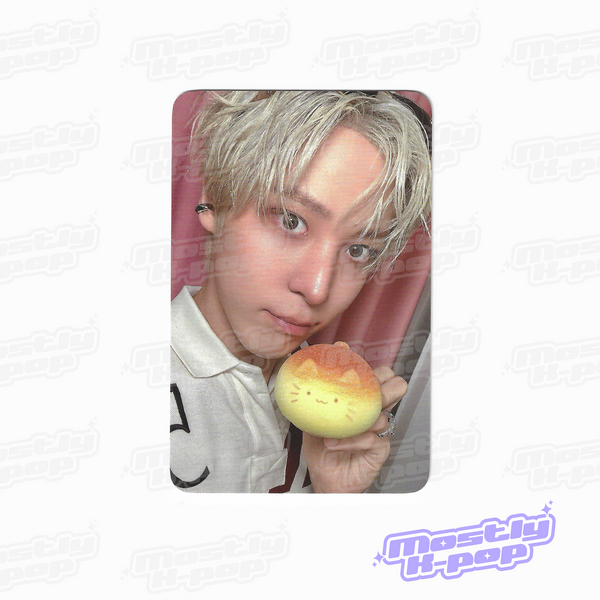 ATEEZ key chain photo card showing a member holding a yellow character charm