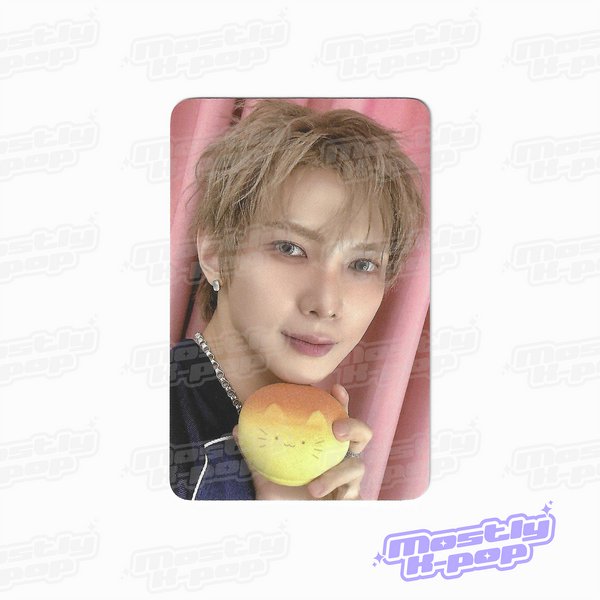 ATEEZ key chain photo card showing a member holding a yellow character charm