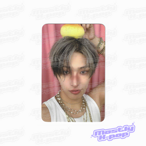 ATEEZ key chain photo card featuring a member holding a yellow character charm